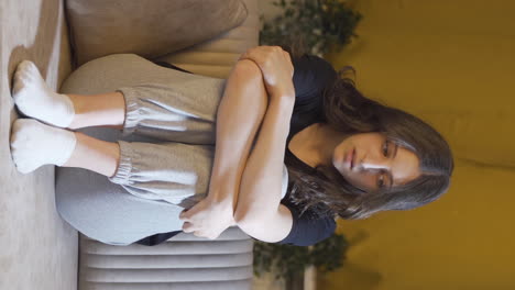 Vertical-video-of-Depressed-young-woman-alone-at-home.